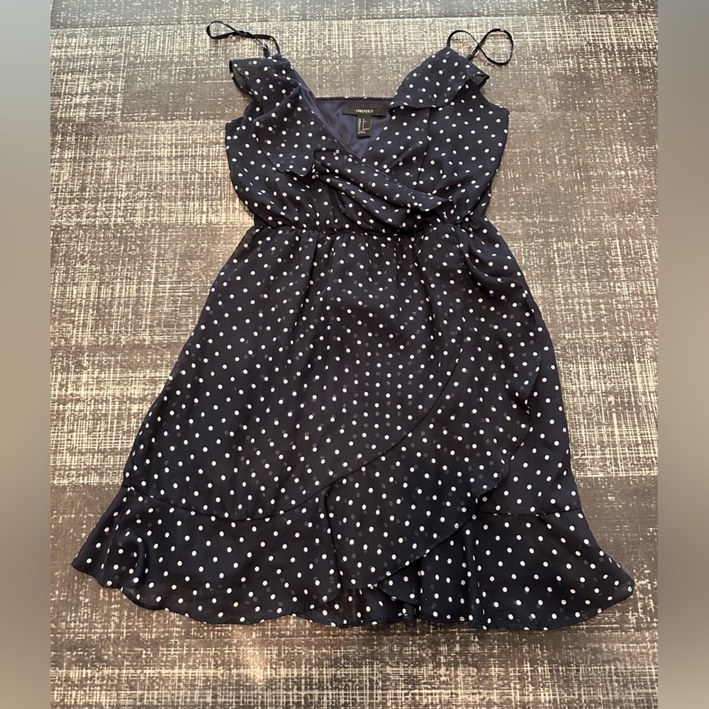 Navy dotted ruffled wrap mini dress.